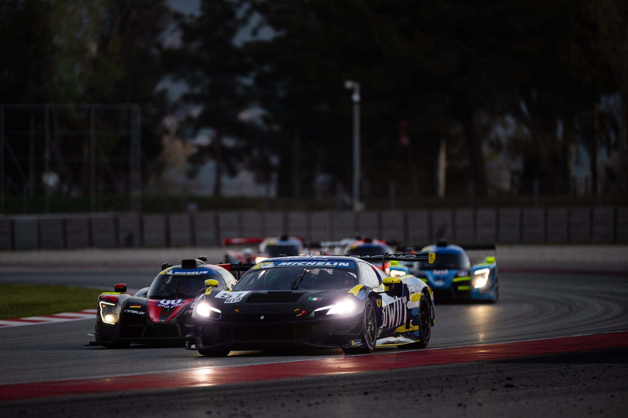 An AF Corse Ferrari GT3 competiting in a 2025 Michelin Le Mans Cup night race