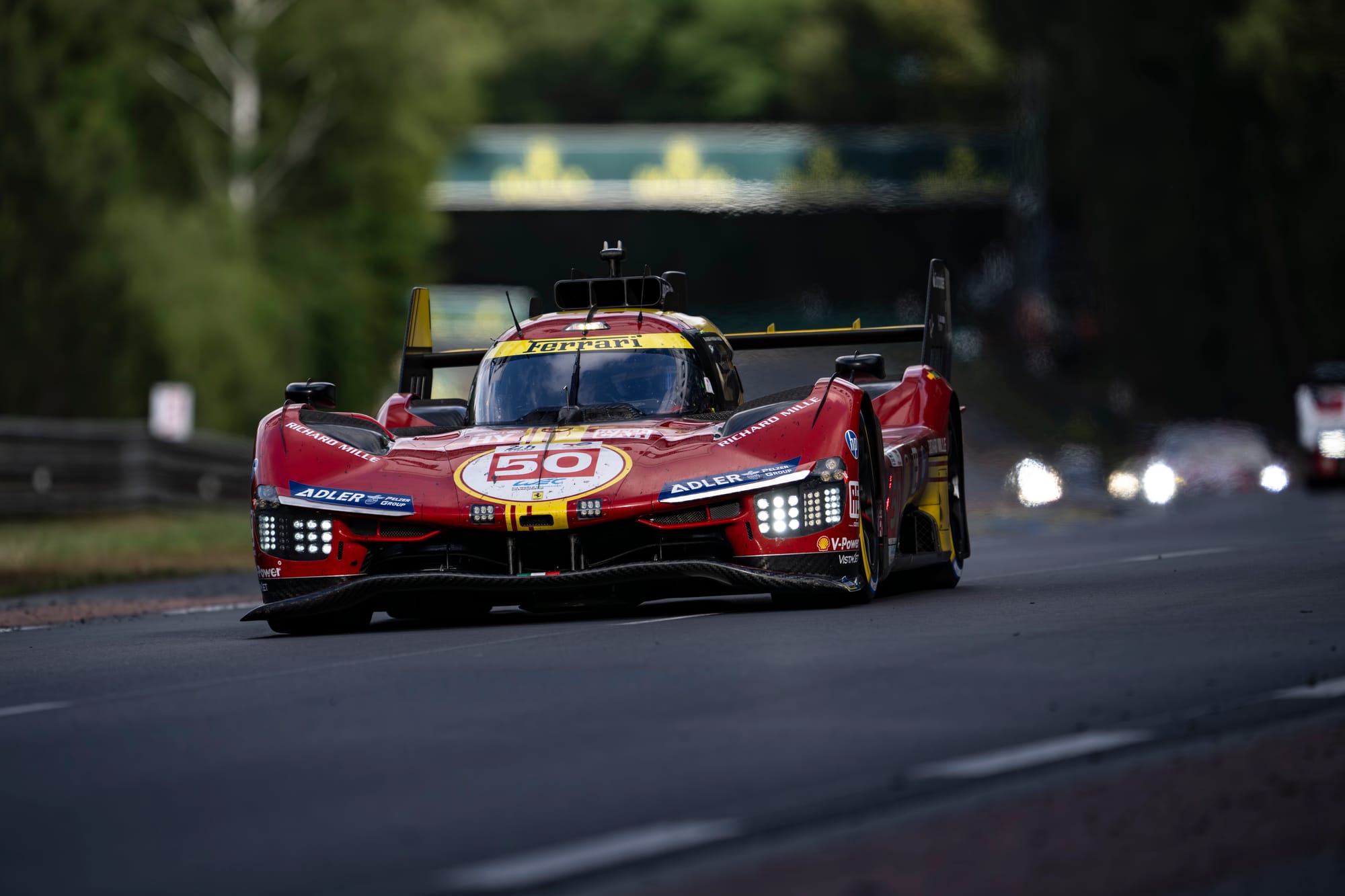 #50 Ferrari 499P competing at the 24 Hours Of Le Mans in the FIA World Endurance Championship