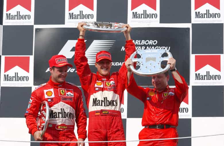 The best Ferrari F1 driver Michael Schumacher celebrating a win alongside Rubens Barrichello