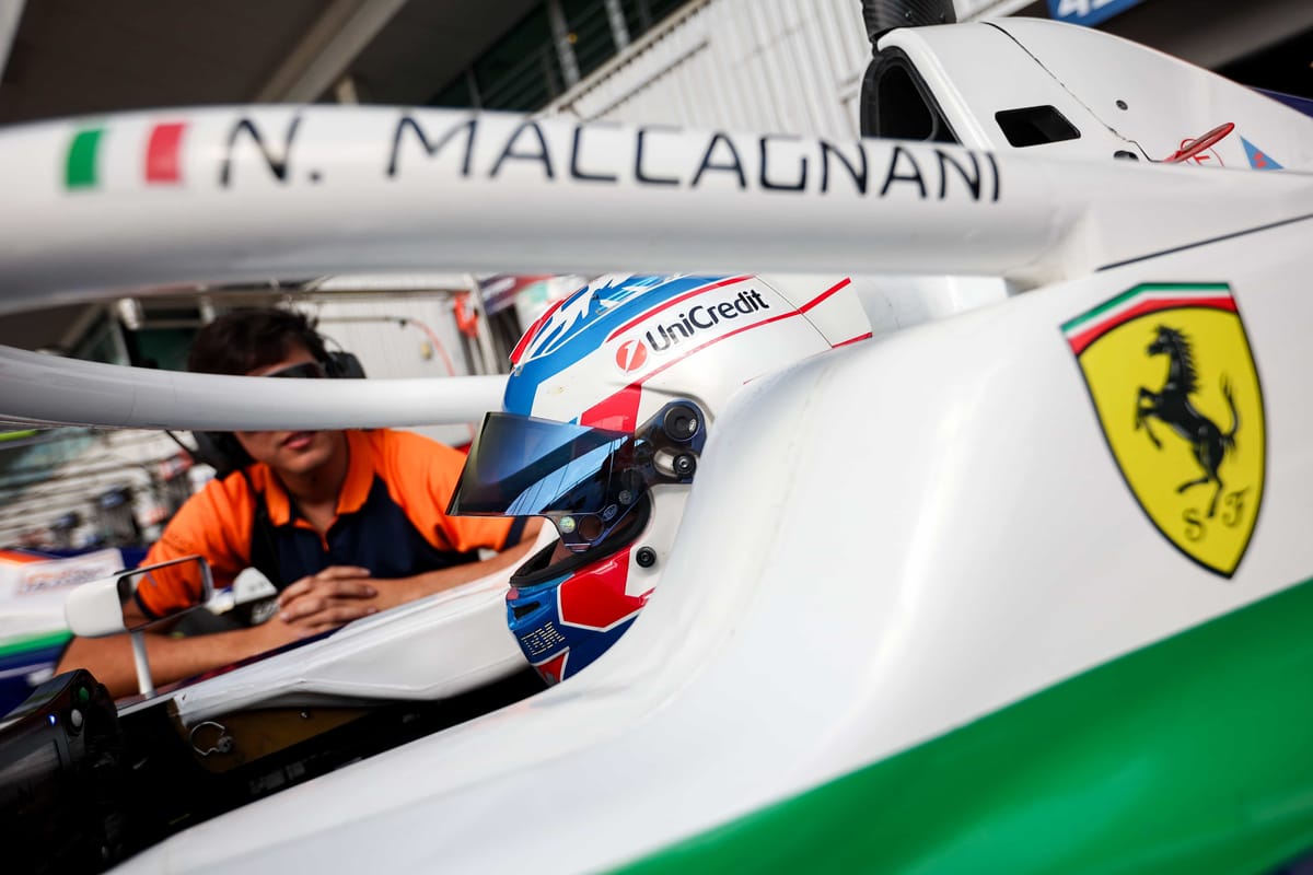 Niccolo Maccagnani sitting in a Ferrari branded Formula 4 car