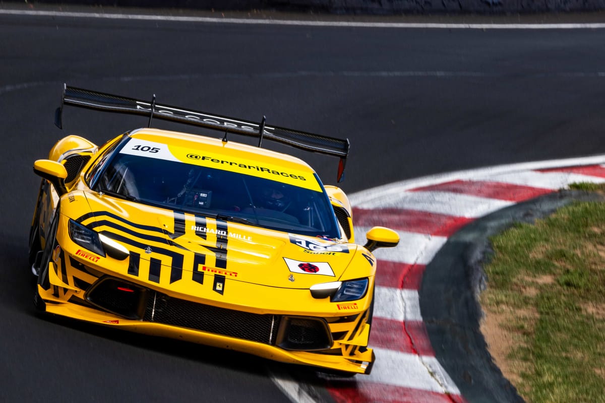 A 2026 Ferrari 296 Challenge with a Japan flag on the bonnet