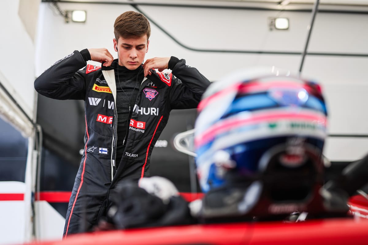 F3 driver Tuukka Taponen getting ready for a race in the paddock