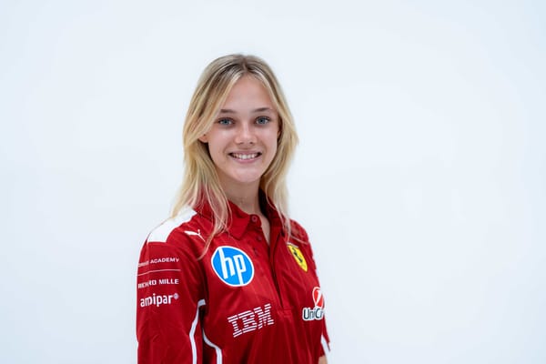 F1 Academy driver Alba Hurup Larsen in a white room