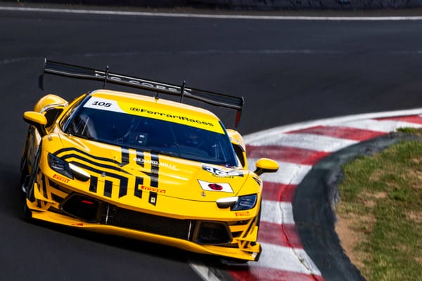 A 2026 Ferrari 296 Challenge with a Japan flag on the bonnet